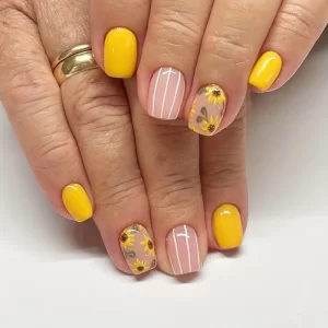 Bright sunflower press ons by Quick Nails