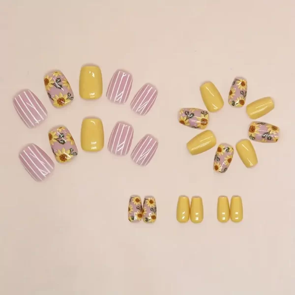 Bright sunflower press ons by Quick Nails