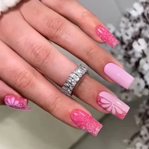 Medium-long square pink glitter press-on nails for a chic, minimalist look.